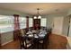 Charming dining room with hardwood floors and seating for eight at 1111 Harefield Cir, Sun City Center, FL 33573
