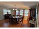 Classic dining room features hardwood floors and large windows at 1111 Harefield Cir, Sun City Center, FL 33573