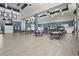 Expansive event space with tables, a bar, blue accents, and plenty of room to move around at 1111 Harefield Cir, Sun City Center, FL 33573