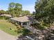 This well-maintained home features beautiful landscaping, mature trees, and a welcoming front porch at 1111 Harefield Cir, Sun City Center, FL 33573