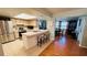 Bright kitchen features a breakfast bar, stainless steel appliances, and a tile backsplash at 1111 Harefield Cir, Sun City Center, FL 33573