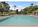Outdoor pool with deck chairs, patio tables, and gazebo at 1111 Harefield Cir, Sun City Center, FL 33573