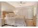 Comfortable bedroom featuring a light and airy space, ceiling fan, and a large closet at 1115 Gulf Of Mexico Dr # 304, Longboat Key, FL 34228