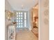 Welcoming entryway with stylish decor leading to a bright bedroom with a comfortable bed at 1115 Gulf Of Mexico Dr # 304, Longboat Key, FL 34228