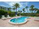 Inviting hot tub with palm trees and lush landscaping perfect for relaxation and tranquility at 1115 Gulf Of Mexico Dr # 304, Longboat Key, FL 34228