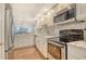 Modern kitchen featuring stainless steel appliances and granite countertops, perfect for cooking enthusiasts at 1115 Gulf Of Mexico Dr # 304, Longboat Key, FL 34228