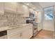 Well-equipped kitchen showcasing granite countertops, stainless steel appliances, and ample cabinet space at 1115 Gulf Of Mexico Dr # 304, Longboat Key, FL 34228