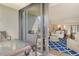 Inviting living room featuring a stylish blue rug and a view of the outdoor seating area at 1115 Gulf Of Mexico Dr # 304, Longboat Key, FL 34228