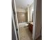 Well-lit bathroom featuring a shower-tub combo, neutral tile, vanity, and a toilet at 119 Maraviya Blvd, Nokomis, FL 34275