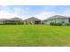 Well-maintained backyard offers ample space for outdoor entertainment and relaxation, complemented by lush greenery and landscaping at 12327 Halfmoon Lake Ter, Bradenton, FL 34211