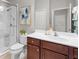 Bathroom features a large vanity, glass enclosed shower and tile flooring at 12327 Halfmoon Lake Ter, Bradenton, FL 34211