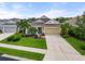 Well-maintained, one story home with a manicured lawn and a two-car garage at 12327 Halfmoon Lake Ter, Bradenton, FL 34211