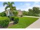 Well-manicured front yard with lush landscaping, a neatly paved sidewalk and a home with great curb appeal at 12327 Halfmoon Lake Ter, Bradenton, FL 34211