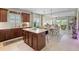 Spacious kitchen with an island, sleek appliances, and an open layout for easy entertaining at 12327 Halfmoon Lake Ter, Bradenton, FL 34211