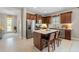 Modern kitchen featuring stainless steel appliances, a central island with seating, and ample storage at 12327 Halfmoon Lake Ter, Bradenton, FL 34211