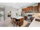 Well-equipped kitchen with a central island, stainless steel appliances, and sleek countertops at 12327 Halfmoon Lake Ter, Bradenton, FL 34211