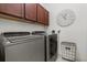 Laundry room with stainless steel washer and dryer and decorative shelving at 12327 Halfmoon Lake Ter, Bradenton, FL 34211
