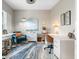 Stylish office space featuring modern decor, ample workspace, and a comfortable seating area at 12327 Halfmoon Lake Ter, Bradenton, FL 34211