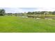 Peaceful pond view from the property's backyard, enhancing the outdoor living experience with natural beauty and tranquility at 12327 Halfmoon Lake Ter, Bradenton, FL 34211