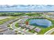 Aerial view of a home in a neighborhood with beautiful lakes and green spaces at 12743 Tahitian Pearl Cir, Parrish, FL 34219
