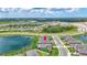 Beautiful aerial view showcasing the home's location in a lovely neighborhood with picturesque ponds at 12743 Tahitian Pearl Cir, Parrish, FL 34219