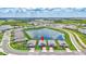 Aerial view of a well-planned community surrounding a lake featuring multiple single-Gathering homes at 12743 Tahitian Pearl Cir, Parrish, FL 34219