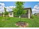 Large backyard with healthy green grass and screened-in lanai, ideal for outdoor enjoyment at 12743 Tahitian Pearl Cir, Parrish, FL 34219
