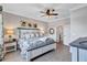 Charming bedroom featuring a comfortable bed, stylish nightstands, and soft lighting at 12743 Tahitian Pearl Cir, Parrish, FL 34219