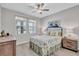 Inviting bedroom featuring wood-look floors, natural light, and tasteful furnishings at 12743 Tahitian Pearl Cir, Parrish, FL 34219