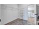 Walk-in closet with wire shelving and rug, with an open doorway to laundry room at 12743 Tahitian Pearl Cir, Parrish, FL 34219