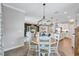 Open floor plan with view of kitchen and living room from dining room featuring table with seating for six at 12743 Tahitian Pearl Cir, Parrish, FL 34219