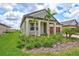 Charming home with well-maintained lawn and decorative landscaping features palm trees at 12743 Tahitian Pearl Cir, Parrish, FL 34219