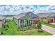 Well-manicured home with a beautiful lawn and landscaping. Close to lakes and community at 12743 Tahitian Pearl Cir, Parrish, FL 34219