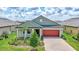 Charming single-Gathering home with a brick driveway and beautifully landscaped front yard in a Gathering-friendly neighborhood at 12743 Tahitian Pearl Cir, Parrish, FL 34219