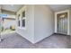 Inviting front porch with brick flooring and neutral tones, perfect for relaxing at 12743 Tahitian Pearl Cir, Parrish, FL 34219
