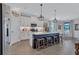 Modern kitchen with white cabinets, a dark blue island with seating, and stainless steel appliances, perfect for entertaining at 12743 Tahitian Pearl Cir, Parrish, FL 34219