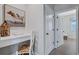 Hallway desk/office space with a white chair and desk in a neutral colored room at 12743 Tahitian Pearl Cir, Parrish, FL 34219