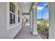 Exterior of home showing columns and a walkway to the front door with lovely landscaping at 12743 Tahitian Pearl Cir, Parrish, FL 34219