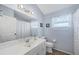 Well-lit bathroom featuring a single vanity and a shower-tub combo at 1451 Fawnwood Cir, Sarasota, FL 34232