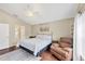 Bedroom featuring a cozy chair, ceiling fan, and hardwood floors at 1451 Fawnwood Cir, Sarasota, FL 34232