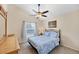 Cozy bedroom with a ceiling fan, a window, and a comfortable-looking bed at 1451 Fawnwood Cir, Sarasota, FL 34232