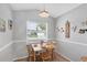 Cozy breakfast nook featuring a wood table, chairs, and natural light from the window at 1451 Fawnwood Cir, Sarasota, FL 34232