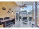 Relaxing screened patio area with comfortable seating and decorative wall accents at 1451 Fawnwood Cir, Sarasota, FL 34232