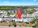 Aerial view of the property highlights location near a pond, other homes and proximity to the city at 17 Braden Castle Dr, Bradenton, FL 34208