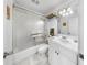 Well-lit bathroom with a shower over tub, a white vanity, and tile flooring at 17 Braden Castle Dr, Bradenton, FL 34208