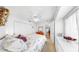 Bright bedroom features carpet, ceiling fan, and built-in storage for optimal organization at 17 Braden Castle Dr, Bradenton, FL 34208