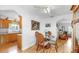 Cozy dining area with a round glass table, adjacent to the updated kitchen and living area at 17 Braden Castle Dr, Bradenton, FL 34208