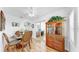 Dining area featuring a glass top table, wood floors, and view to the living and office area at 17 Braden Castle Dr, Bradenton, FL 34208