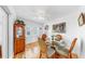 Comfortable dining area with wood floors, a glass table, and a cabinet for storage at 17 Braden Castle Dr, Bradenton, FL 34208