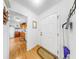 Entryway with wood-look flooring, closet, and access to the kitchen at 17 Braden Castle Dr, Bradenton, FL 34208